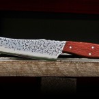Küchenmesser "Santoku"
Stahl = N 690 
Griff aus Perlholz
Gesamtlänge: 302mm Stärke: 2,5mm